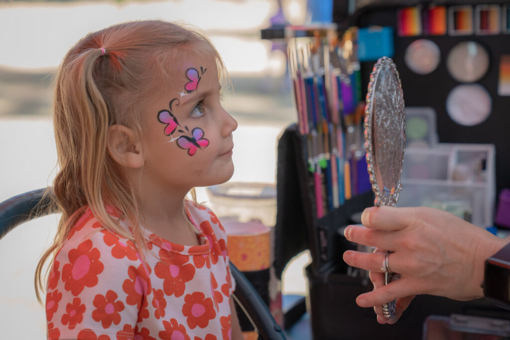 Face painting at the Englewood Forest Festival